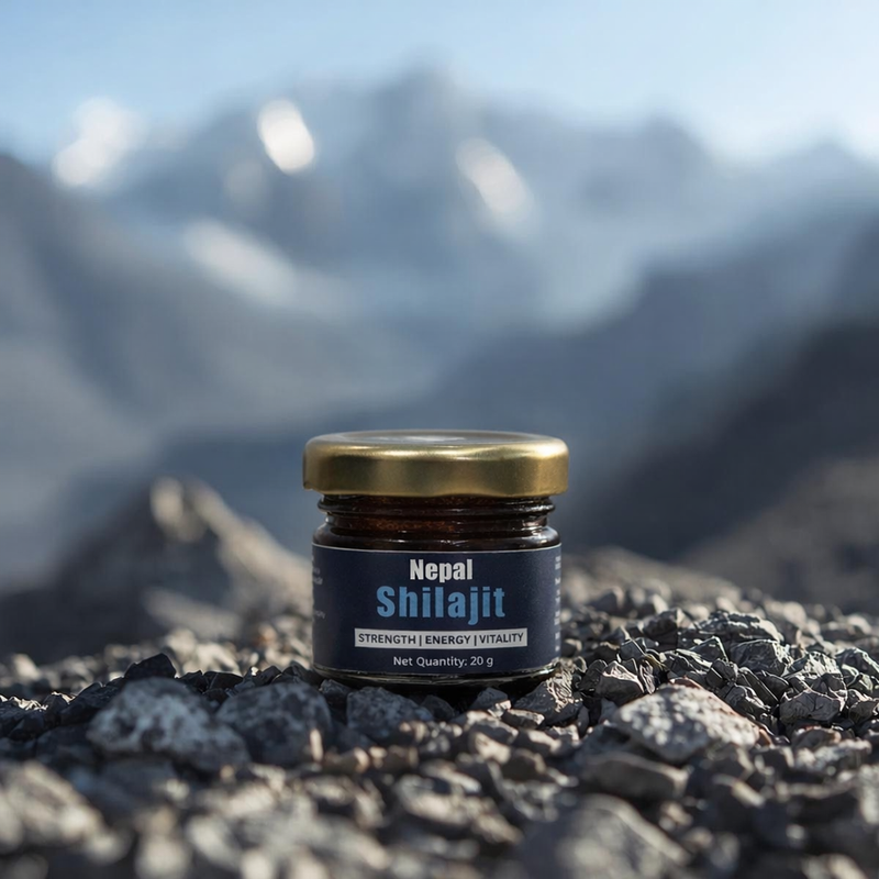 Jar of Nepal Shilajit on a rocky surface with mountains 