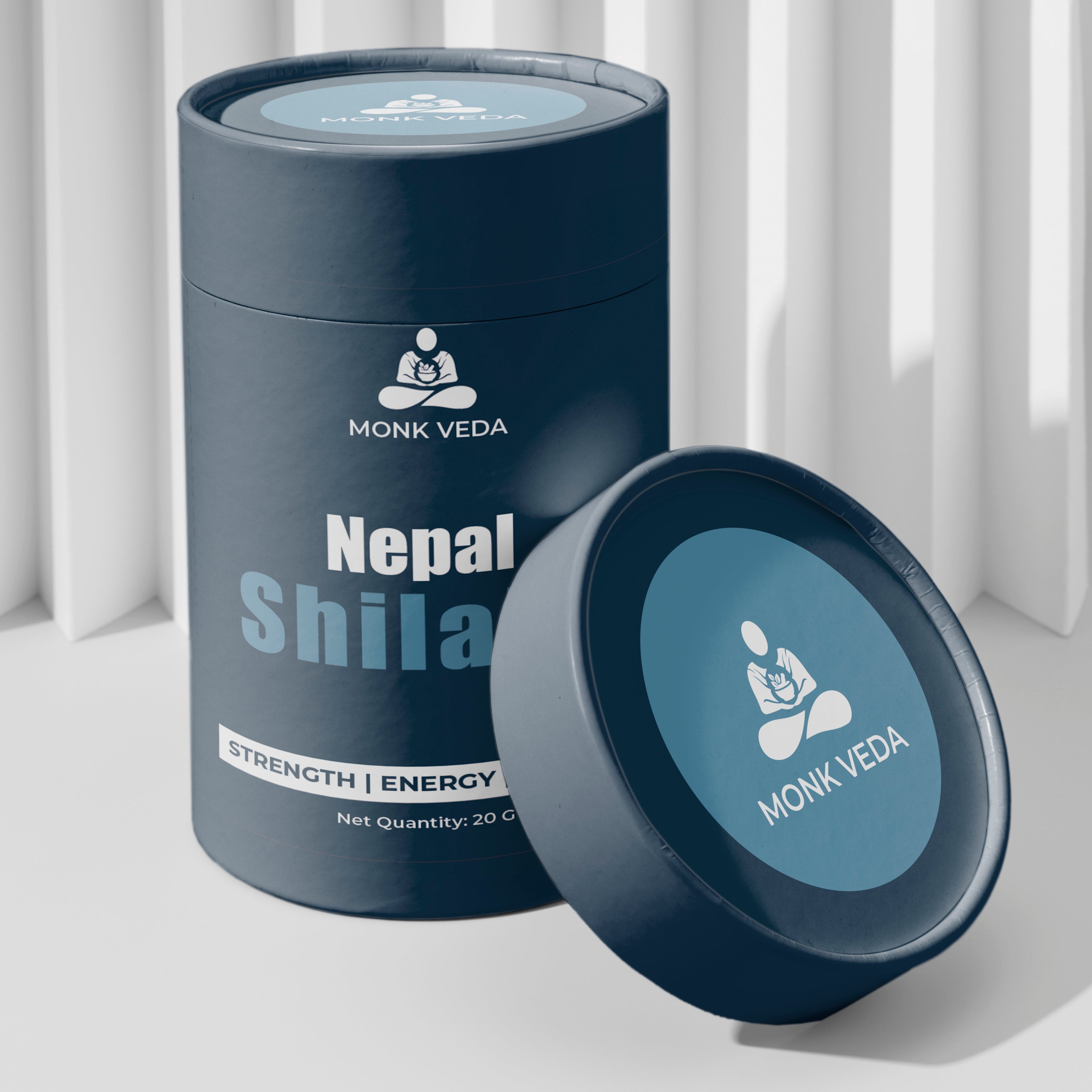 Blue container labeled 'Nepal Shila' by Monk Veda on a light background